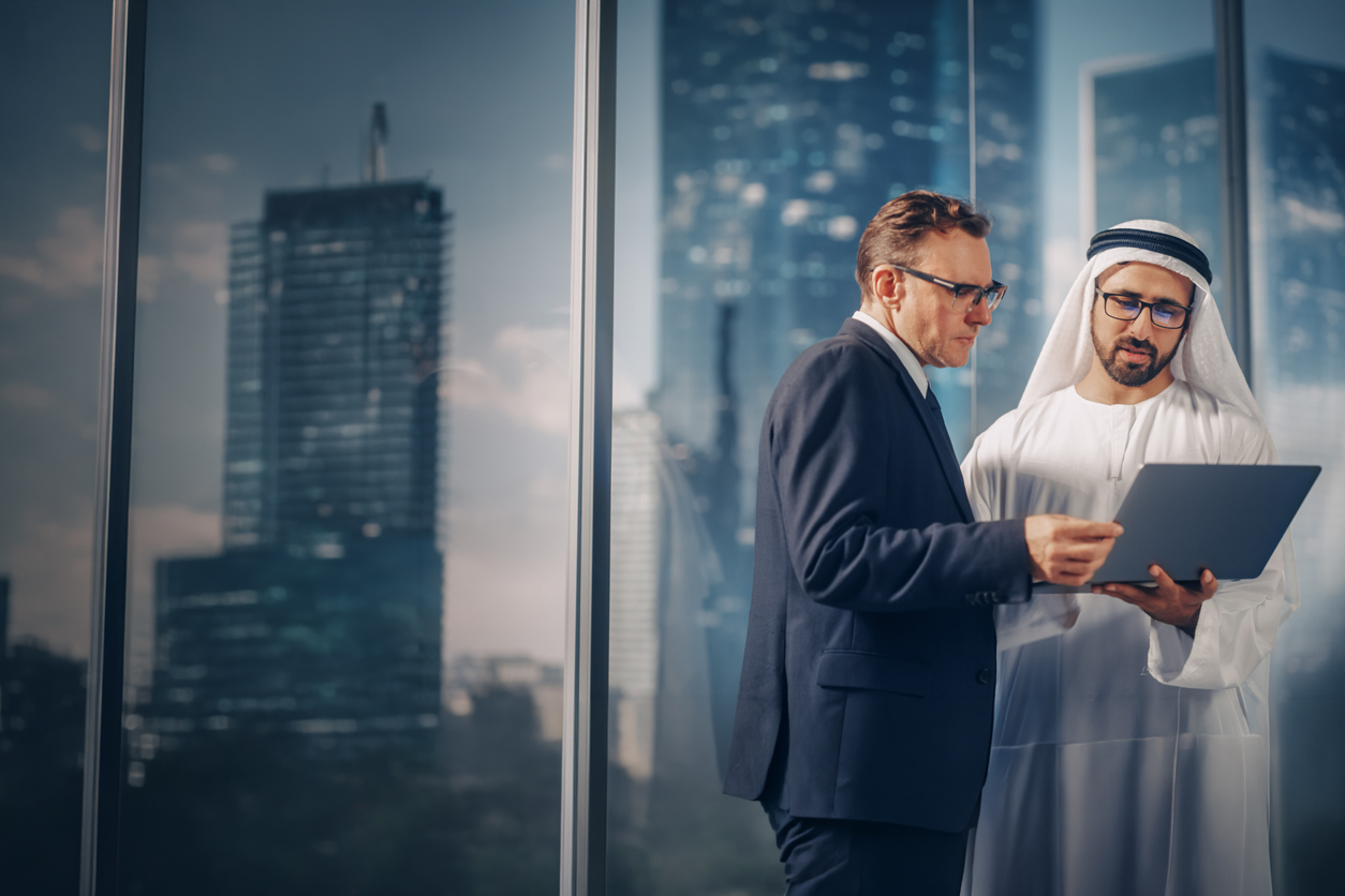 UAE business advisers reviewing a company setup plan in a Dubai office