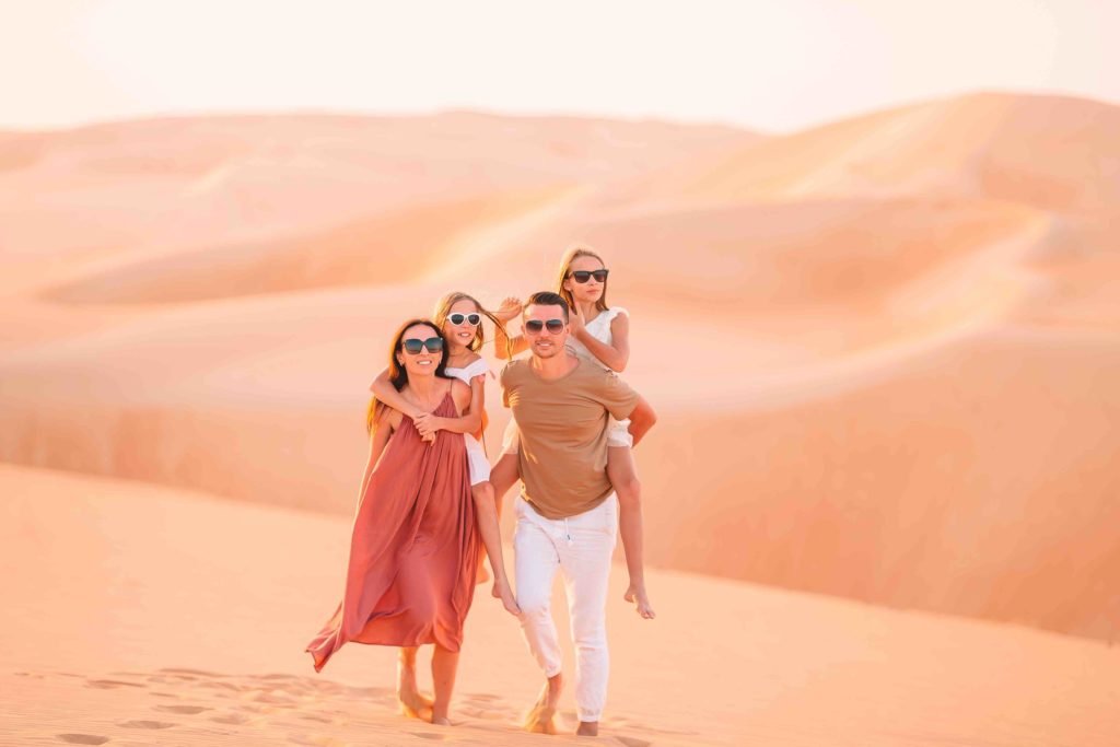 Family in Dubai sand dunes