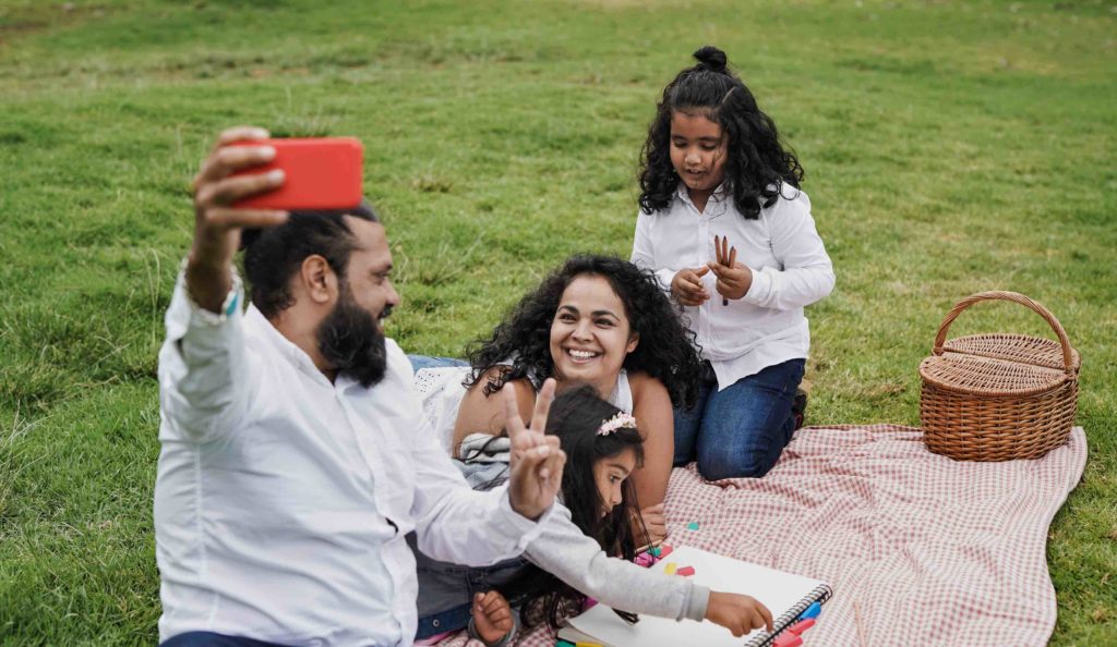 Happy family enjoying day in the park in Dubai
