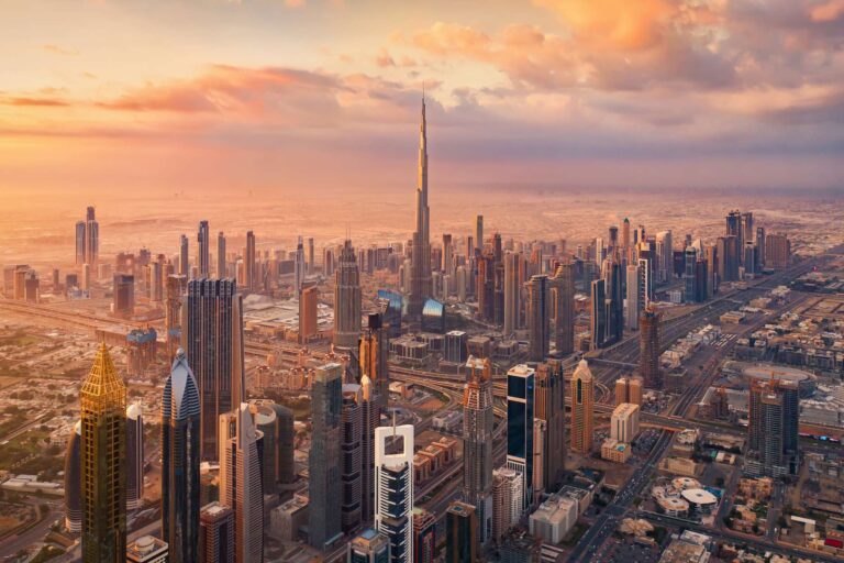 Dubai skyline and modern business district representing tax in Dubai for individuals and companies.