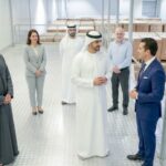 UAE business leaders discussing local industry inside a warehouse as part of the ICV certification process.