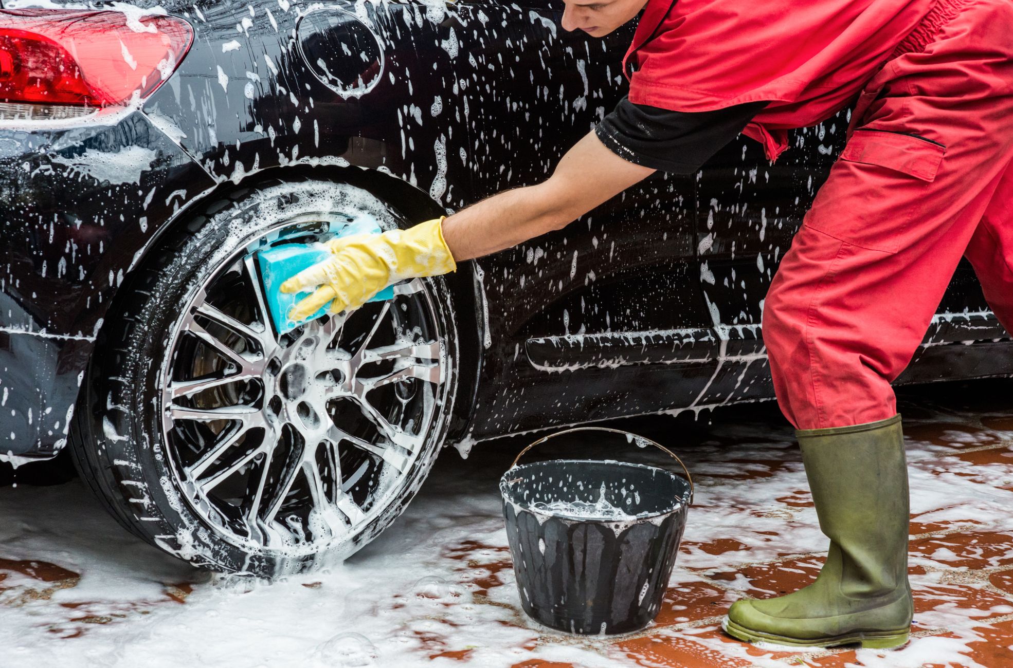Stock image of man working at car wash