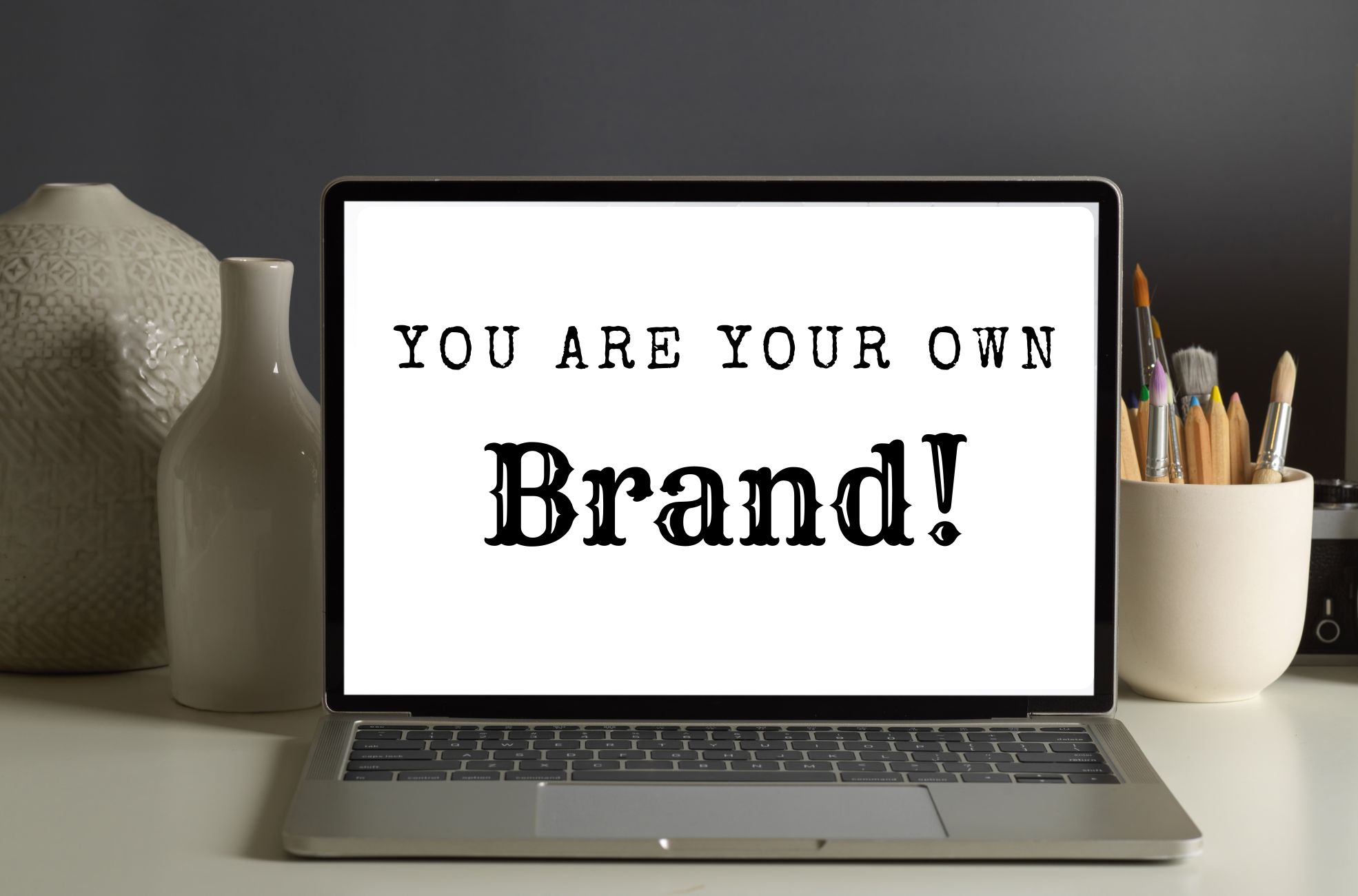 MacBook With "You Are Your Own Brand" Written On it