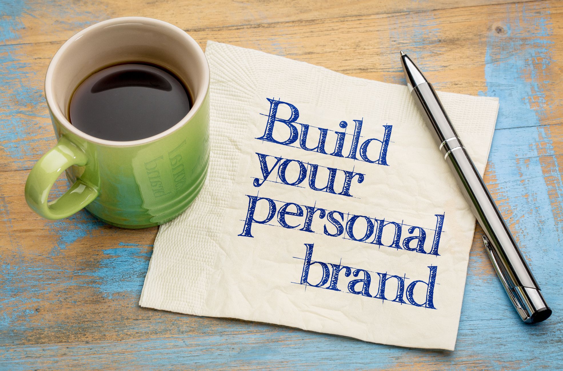 Personal Branding On Paper Next To Coffee Showing Solopreneurship