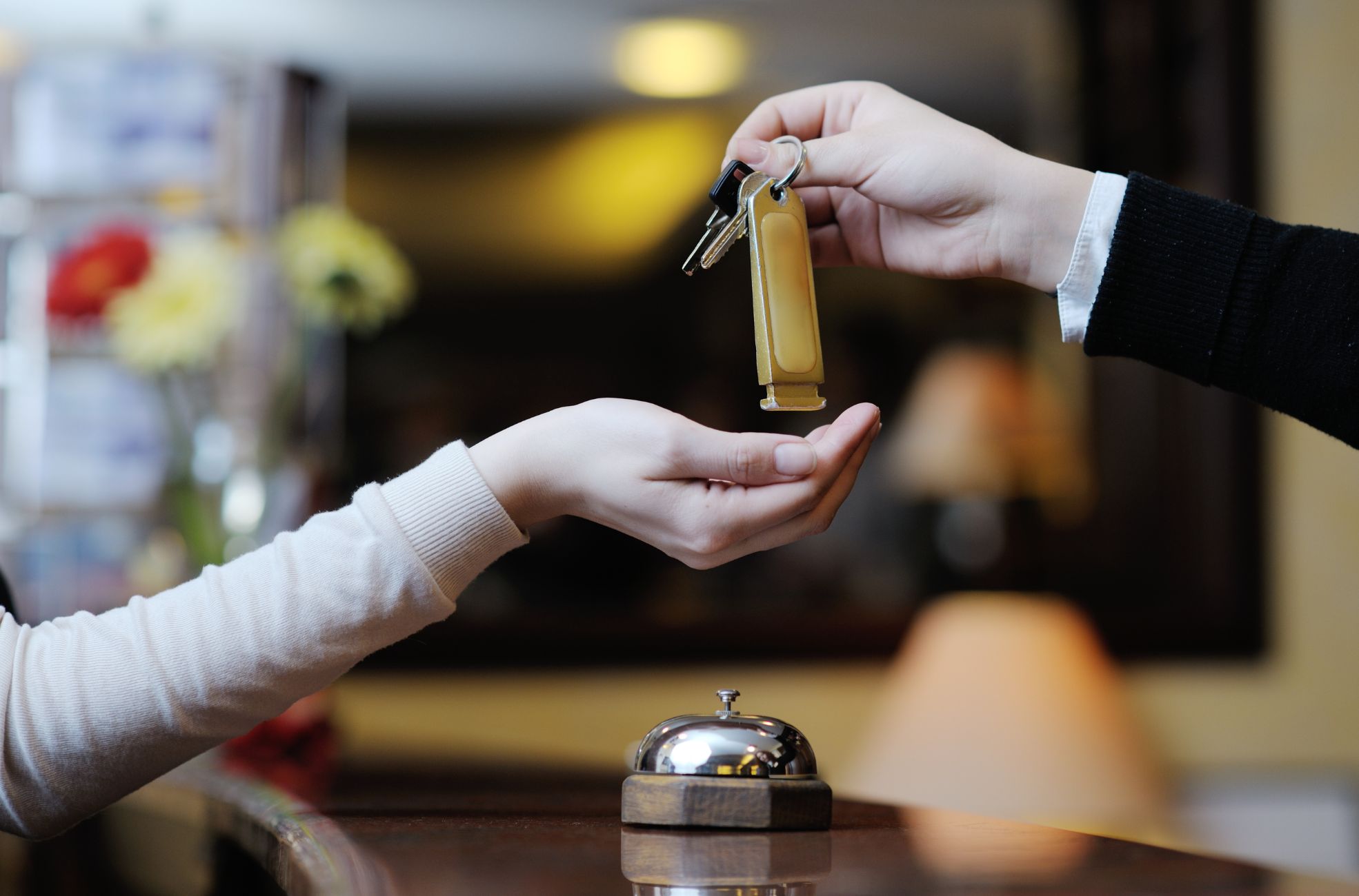 Hotel Keys Being Handed To Guest