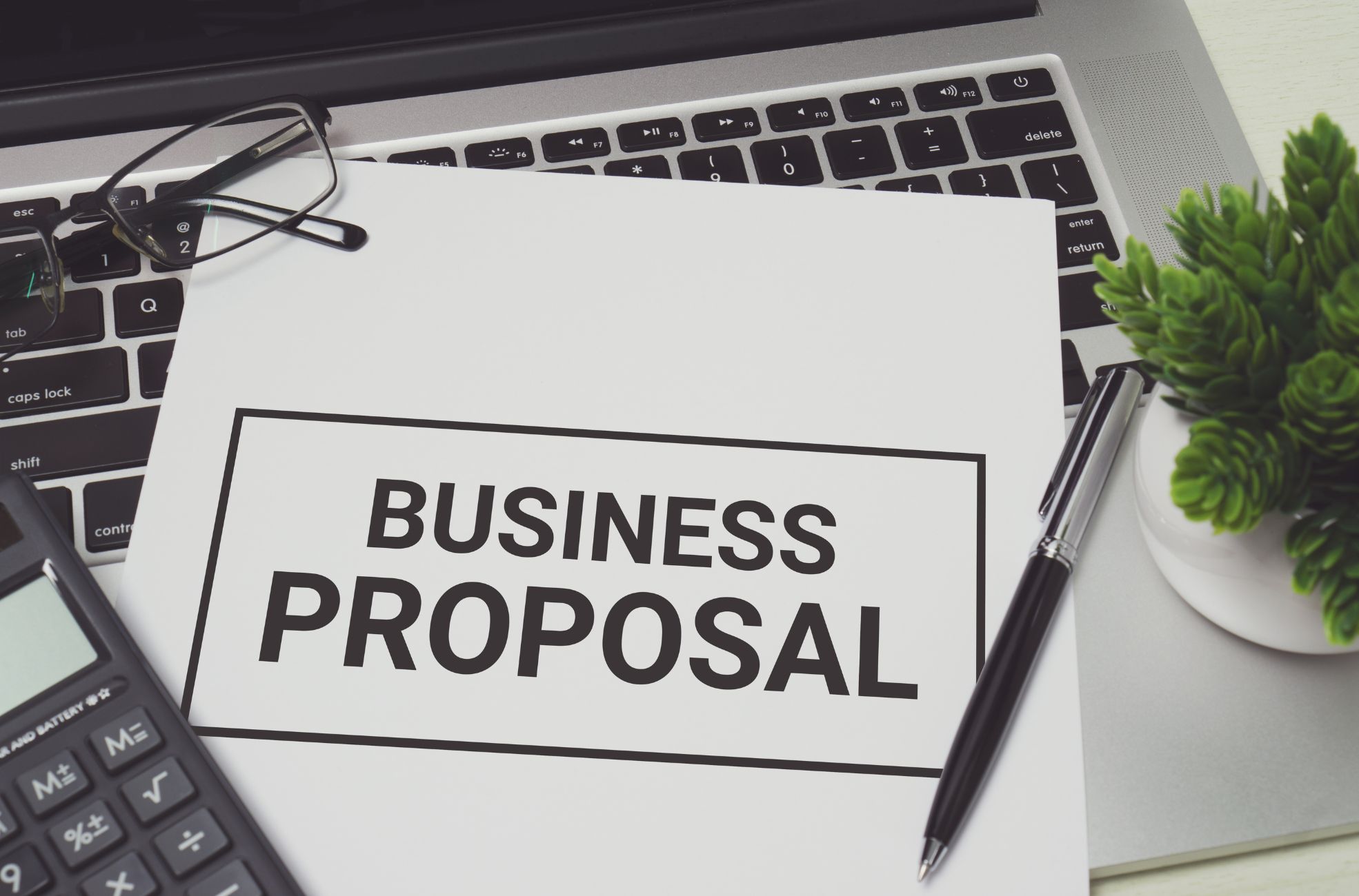 Document Titled Business Proposal On Laptop