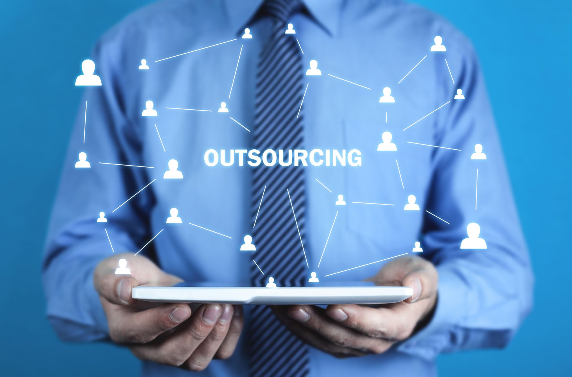 Business Man Pointing To Word "Outsourcing"