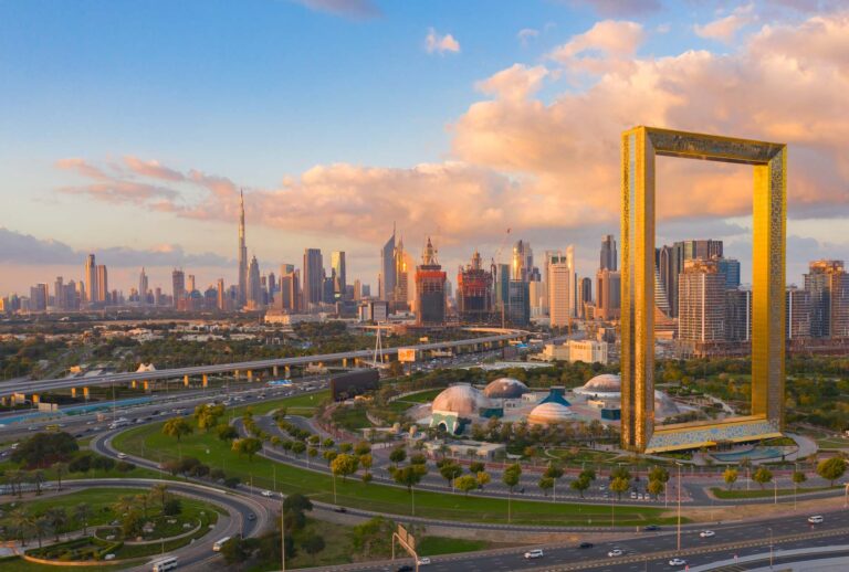 Dubai Frame overlooking the city skyline at sunset.