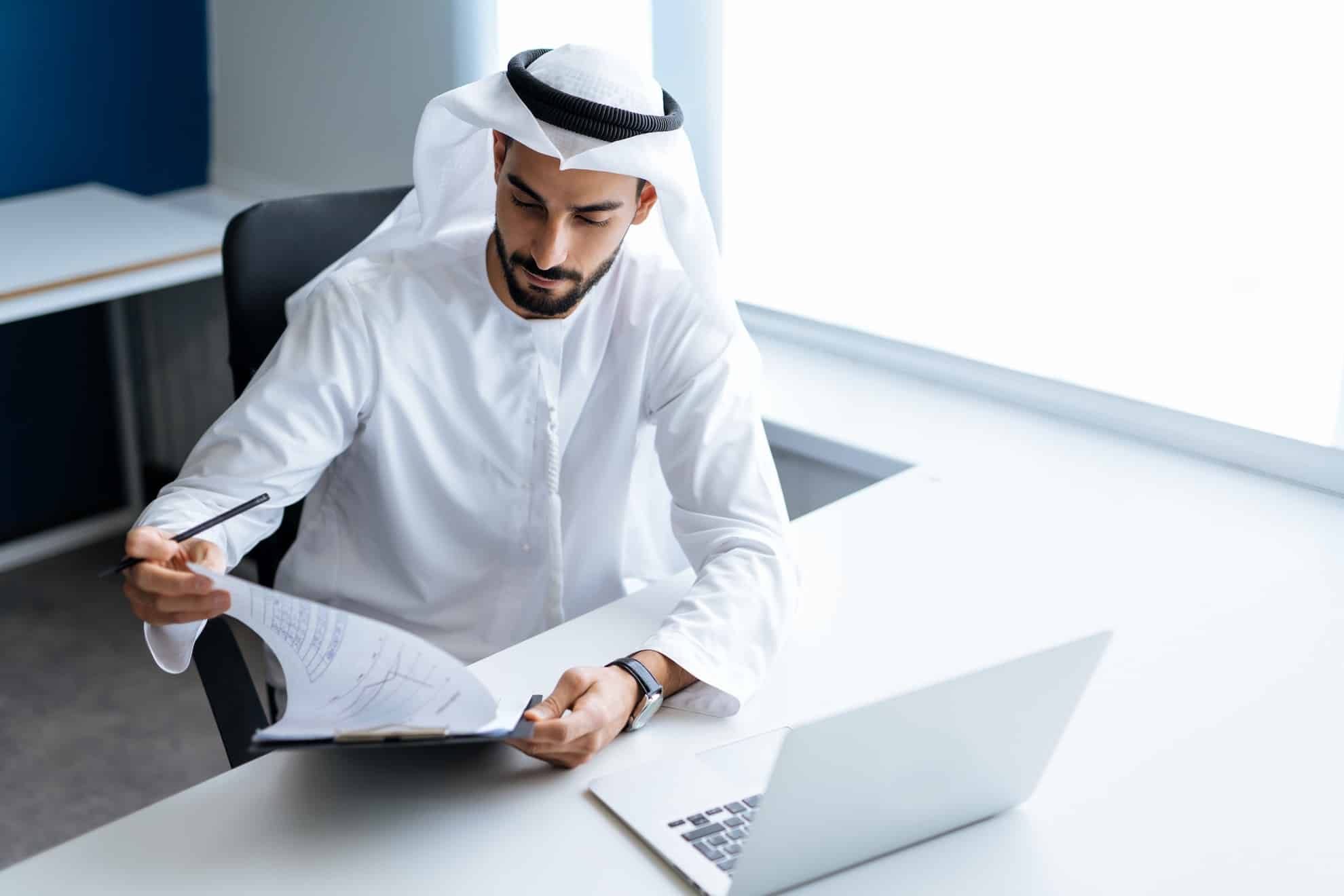 A man in the UAE completing his corporate tax registration in the UAE.