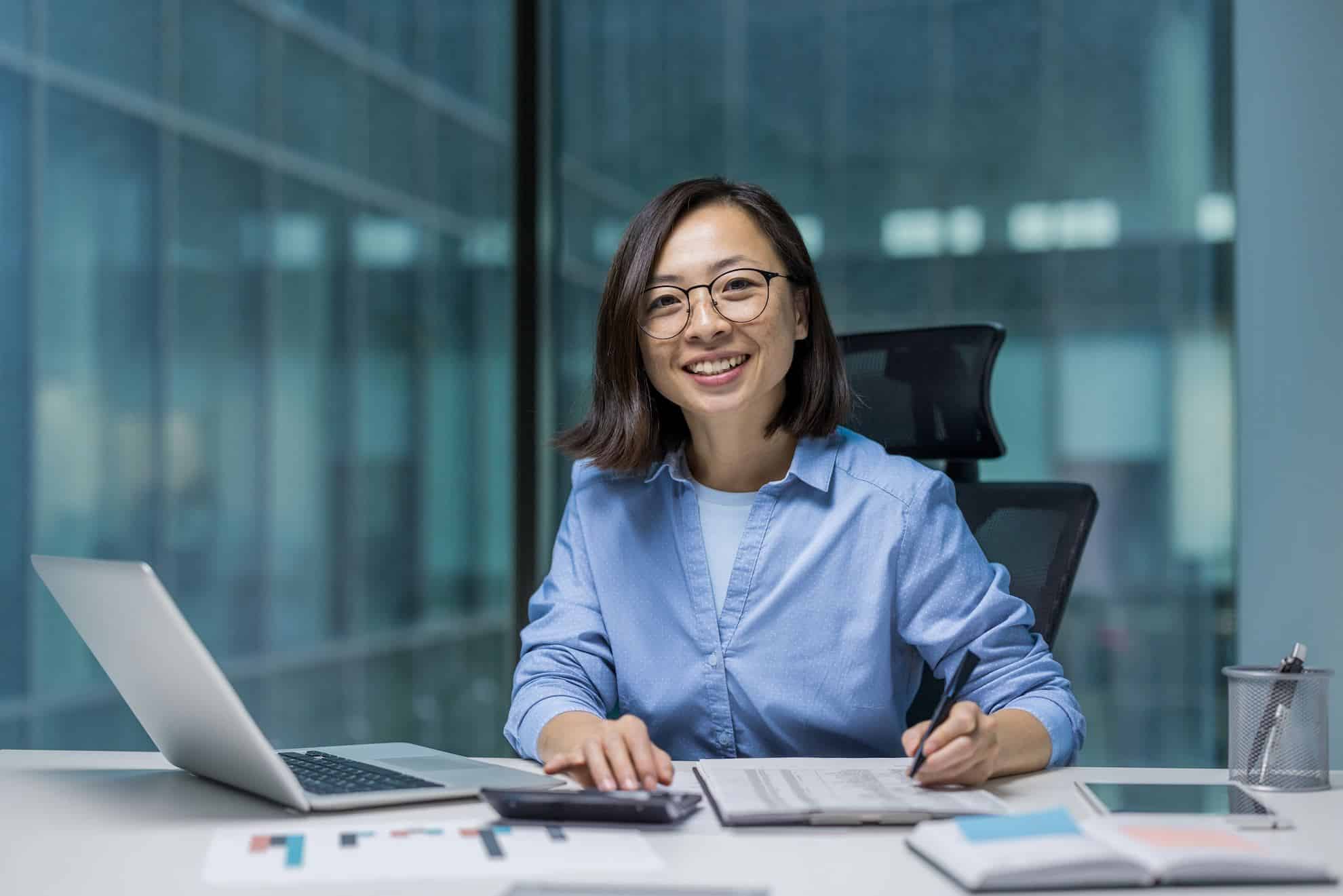 Business professional reviewing financial documents at a desk, illustrating VAT compliance and exemption assessment in the UAE.