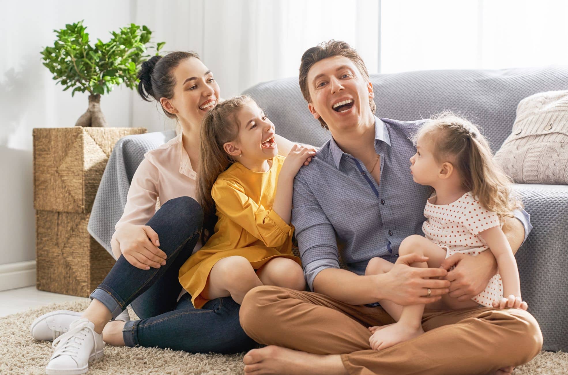 Happy Family On Couch