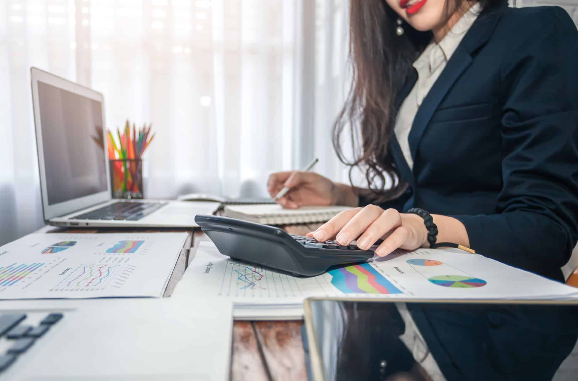 Female Accountant Working At Desk