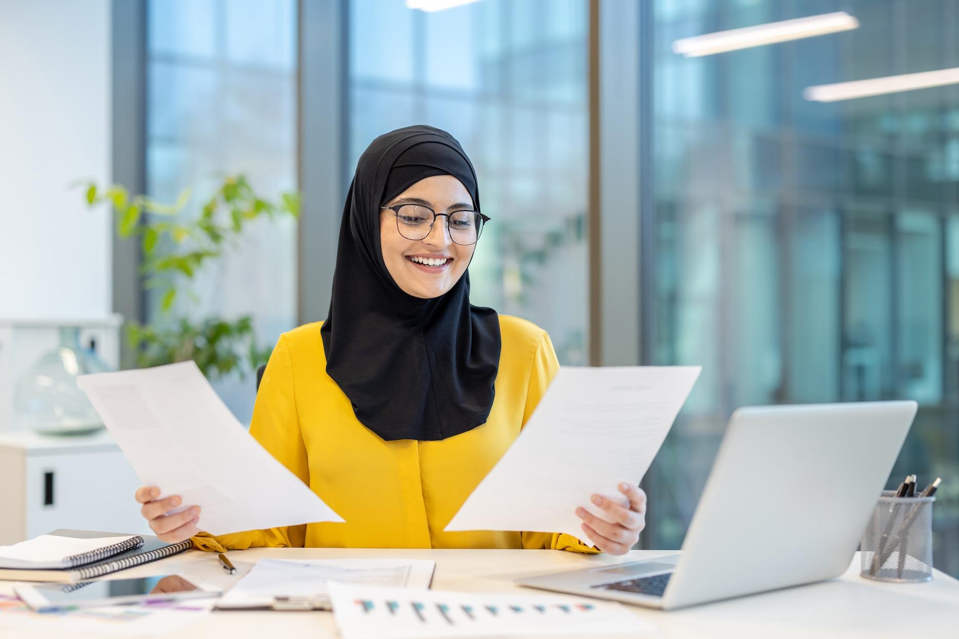 Professional reviewing ADGM SPV registration documents in a modern UAE office.