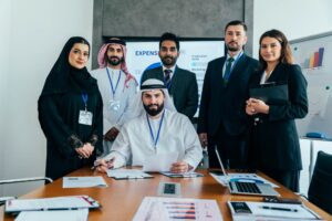 Multiethnic business professionals meeting in a modern Dubai office.